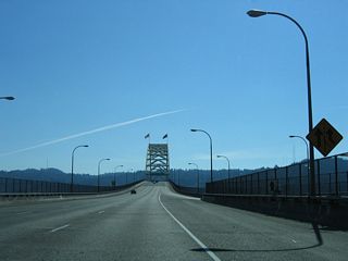 Ramps from I-5 converge with the Stadium Freeway spur angling southwest from the intersection of Gantenbein Avenue and Kerby Avenue.