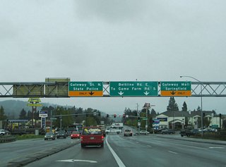 Randy Pepe Beltline transitions into Belt Line Road at the signalized intersection with Gateway Road east of I-5. An end shield for OR 569 was added to this overhead sign bridge between 2005 and 2007. Gateway Road travels south to The Shoppes at Gatewa in Springfield and northwest to Coburg Road. Belt Line Road ends 0.4 miles ahead at Game Farm Road.