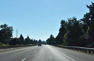 OR 569 wedges between residential neighborhoods as the freeway advances east to River Road (Exit 8) next. 