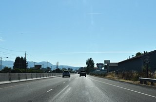 OR 569 proceeds east from Exit 8 (River Road) to Right in-Right out (RIRO) ramps with River Avenue ahead of the Willamette River.