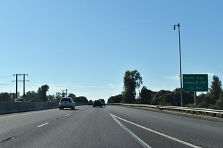 OR 569 (Randy Papé Beltline) crosses over the Willamette River 0.50 miles out from the parclo interchange with OR 132 (Delta Highway) south to Interstate 105.