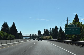 OR 569 (Randy Papé Beltline) advances east from OR 132 (Delta Highway), crossing under Norkenzie Road one half mile west of a diamond interchange (Exit 12) with Coburg Road.