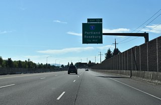OR 569 east next meets Interstate 5 at a cloverstack interchange (Exit 13) in one quarter mile. I-5 straddles the Eugene and Springfield city lines between the overpass with Gateway Srteet south to the interchange with Glenwood Boulevard beyond the Willamette River.