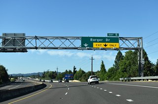 The entrance ramp from OR 99 adds an auxiliary lane on OR 569 westbound for Exit 5 to Barger Drive. The forthcoming diamond interchange is the last exit along Randy Papé Beltline.