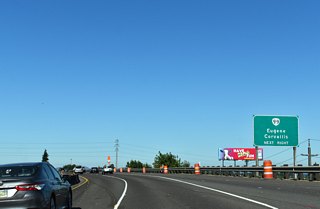 Belt Line Highway turns southward ahead of the OR 99 (Pacific Highway) and Southern Pacific Railroad line over crossing. The former U.S. 99 is the main route between Eugene and Corvalis, 34 miles to the northwest.