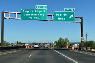 Belt Line Highway spans Northwest Expressway and Amtrak ahead of the half diamond interchange (Exit 7A) with Prairie Road. Prairie Road is a 9.5 mile long companion to OR 99 (Pacific Highway) between Eugene and Junction City. The highway passes through industrial areas associated with the adjacent Southeen Pacofic Railroad.