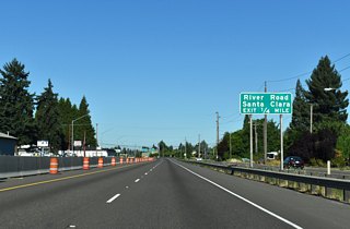 The diamond interchange at Exit 8 joins OR 569 with River Road. River Road is an arterial route between west Eugene and the north suburb of Santa Clara.