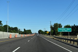 Between Delta Highway and the ramp to Division Avenue, the Belt Line Highway bridge crosses the Willamette River on a retained 1960s-era guard rails and design.