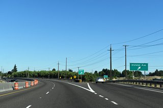 Division Avenue constitutes a westbound frontage road for River Road. The Division Avenue turnaround meets River Avenue on the south side of OR 569. River Avenue parallels the south side of the freeway through an industrial area.