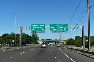 Delta Highway has interchanges with Goodpasture Island Road and Valley Center Drive for Valley River Center mall on the two mile route to I-105/OR 126. North of OR 569, Delta Highway is a two lane arterial to Green Acres and Ayers Roads.