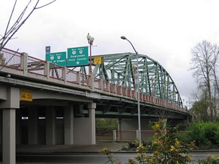 Club Road passes underneath the Coburg Road truss bridge along the north banks of the Willamette River.