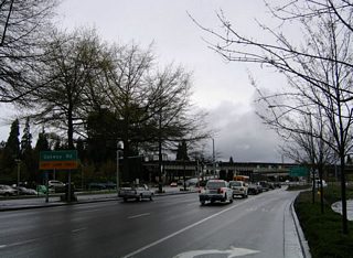 Coburg Road widens to three lanes in anticipation of the signalized intersection with Southwood Lane west and Oakway Road north. Oakway Road travels between Coburg Road and Cal Young Road in north Eugene.