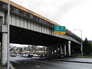 Coburg Road passes underneath the freeway and intersects Country Club Road. Country Club Road forms an eastbound side frontage road between Club Road and the eastbound off-ramp and on-ramps to Interstate 105 & OR 126.