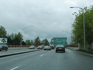 Coburg Road continues south from Martin Luther King Jr. Boulevard to cross Club Road and the north banks of the Willamette River.