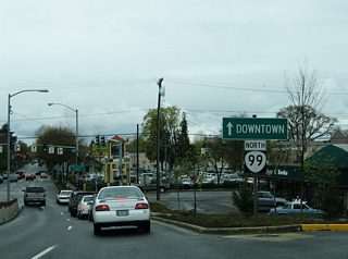 Descending from Coburg Road onto OR 99 north & 126 Business (6th Avenue). A loop ramp splits from the overall ramp to Mill Street east of the viaduct. Drivers otherwise enter the 6th Avenue signalized intersection with High Street.