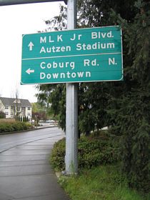 A guide sign posted at the Country Club Road intersection of the Exit 2 off-ramp of Interstate 105 & OR 126 and Club Road correctly partitions traffic to Coburg Road / Downtown to the left and Autzen Stadium straight ahead.
