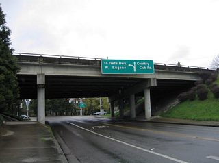 Shifting to Country Club Road westbound at the freeway under crossing and approach to the westbound on-ramp at Southwood Lane. Country Club Road leads west from Club Road and Interstate 105 & OR 126 to the Eugene Country Club and Willagillespie Road.