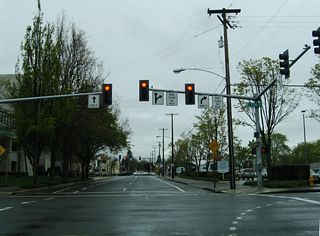 High Street north at 7th Avenue (OR 99/126 Business eastbound). 7th Avenue concludes nearby at the northbound entrance ramp to Coburg Road and Autzen Stadium and the southward turn of OR 99/126 Business onto Mill Street.