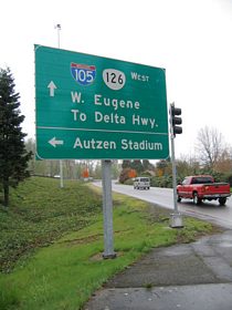The guide sign posted at the Interstate 105 & OR 126 westbound on-ramp from the perspective of Southwood Lane at Country Club Road.