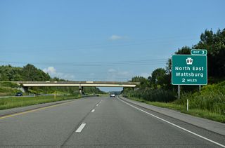 I-86 curves southeast to a diamond interchange (Exit 3) with Pennsylvania Route 89.
