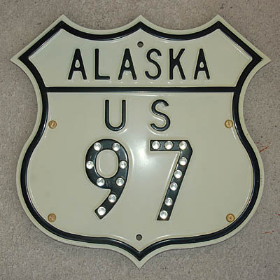 Replica Alaska US 97 shield. Embossed with glass reflectors, circa 1956.