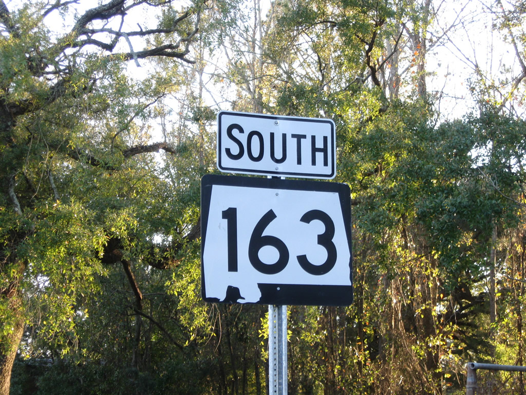 Alabama 163 southbound reassurance shield posted along Dauphin Island Parkway southbound ahead of Duval Street in Mobile.