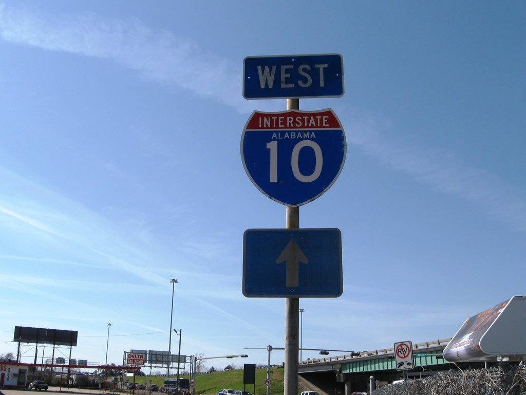 Interstate 10 Alabama shield posted along Canal Street near the Exit 26A off-ramp of the freeway.