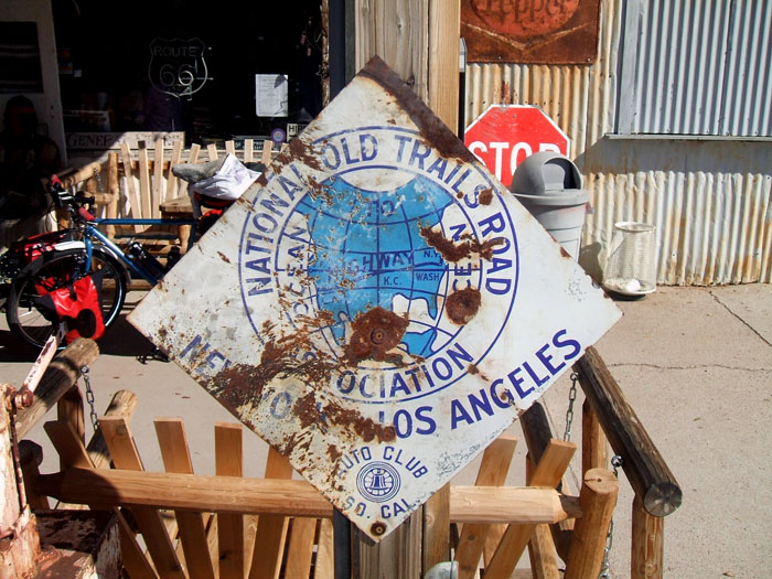 1910s Ocean to Ocean Highway trailblazer, as seen in front of an antique store in Hackberry.