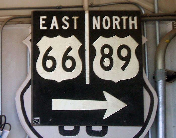 Guide sign in an antique shop in Ash Fork on old US-66.  
