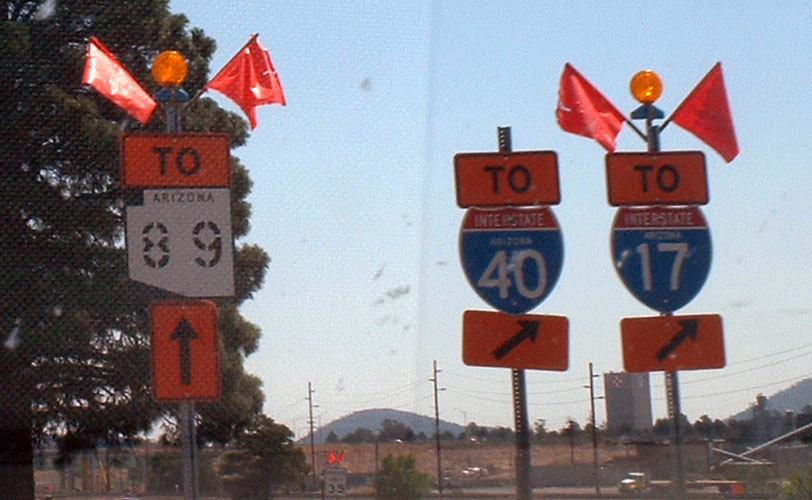 Stenciled highway marker in a construction zone.