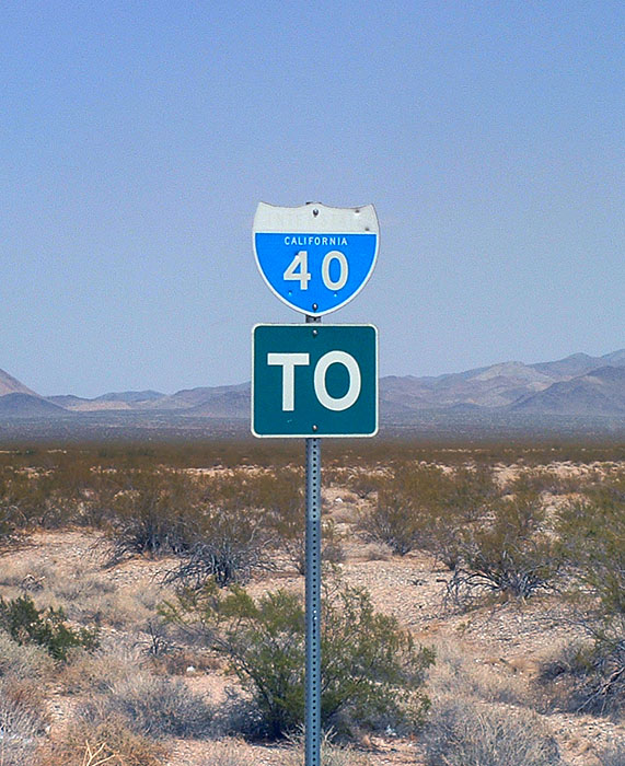 Old US-66 between Ludlow and Needles was signed as I-40 until the freeway was opened in 1972. The TO banner was added much later to the former reassurance assembly.