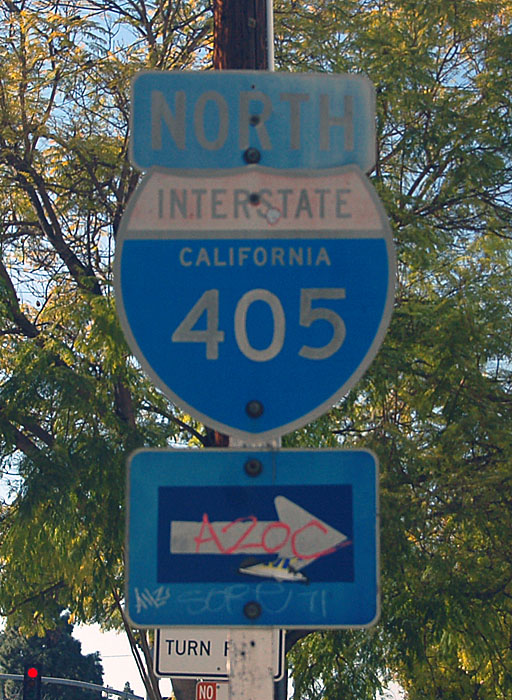 Original 405 shield on a white post that very likely once held a CA-7 shield.