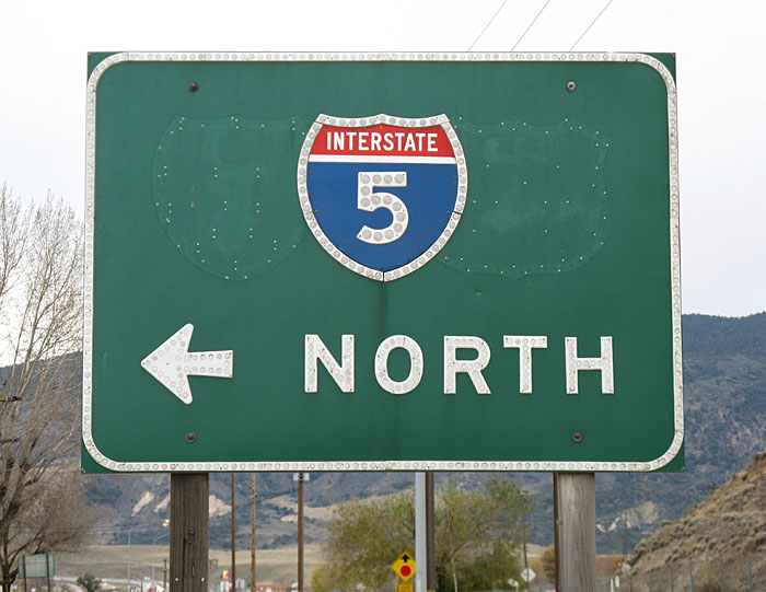 1960s guide sign with US-99 shield removed and I-5 shield relocated.