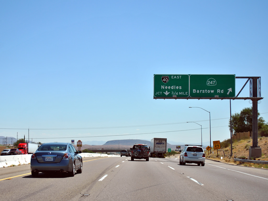 White on black Interstate 40 shield along Interstate 15 in Barstow.