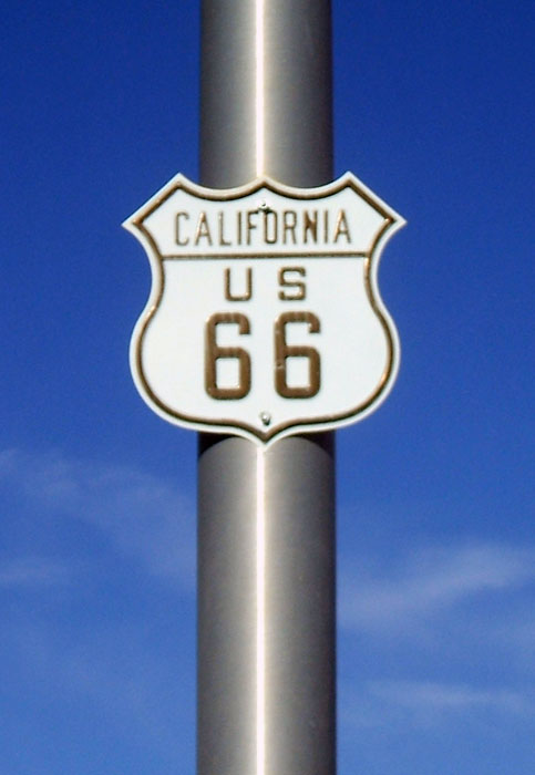 Embossed markers in Needles that date back to the late 1980s. These shields were stamped out by a Route 66 historical society after the road was decommissioned. California did not use this style of shield to mark an active highway.