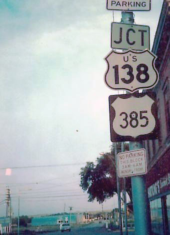 1950s cutout and 1960s black square shields in Julesburg. Not only has it not been taken down, but the alignment of the JCT sign appears to have been touched up over the years. First