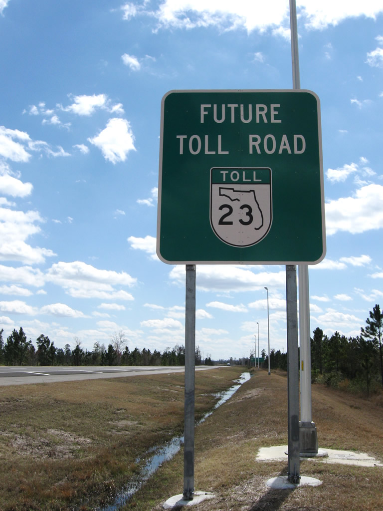 First southbound "Future Toll Road" signage along Florida 23 south of its current northern terminus with Interstate 10 at Exit 350.