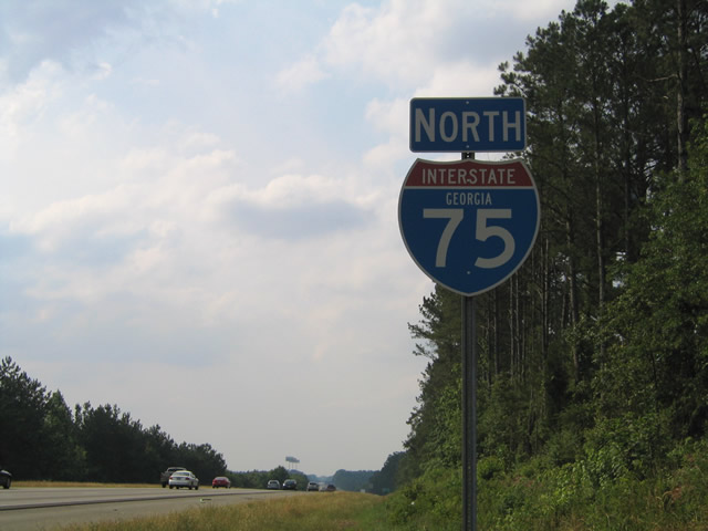 Northbound reassurance marker posted after Exit 212 near Locust Grove.