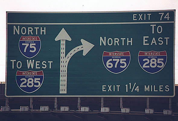 Overhead sign along northbound Interstate 75 approaching junction Interstate 675 .