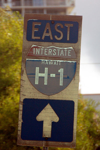 Wooden guide sign in Honolulu.