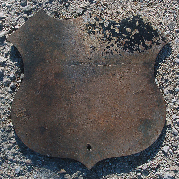 On the back, it looks like at one point the sign was reused as an Iowa US 75 with round fonts.