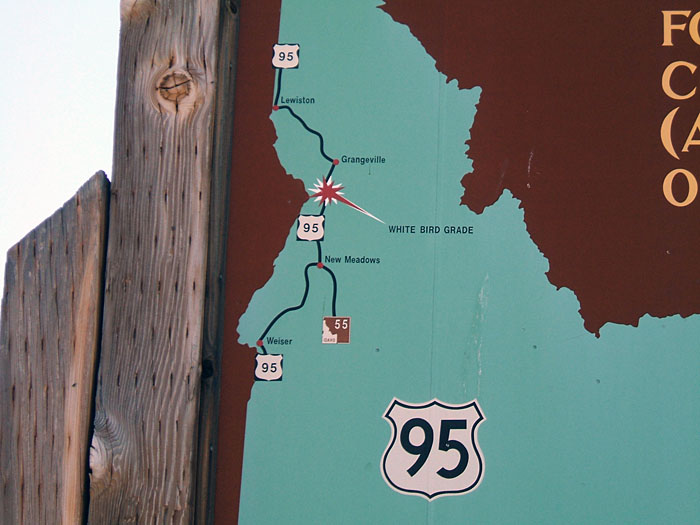 US-95 shield on a historic marker.