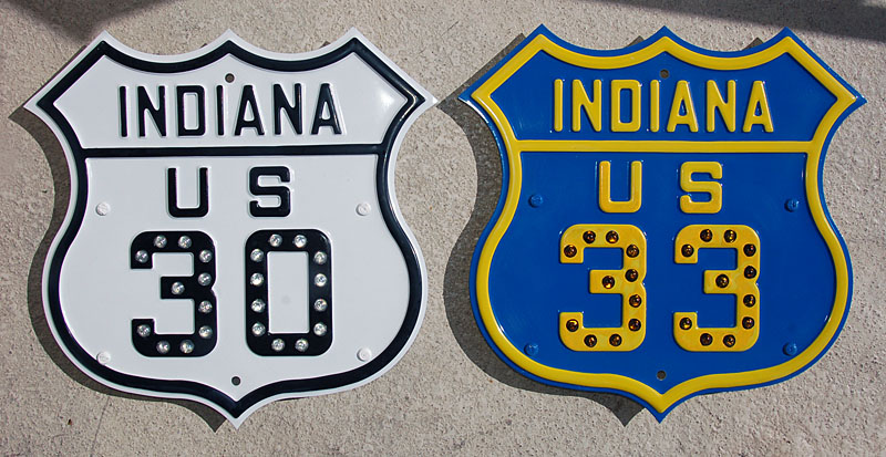 Replicas of 1930s highway markers.