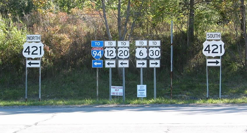 At bottom of off-ramp from Interstate 80-90/Indiana Toll Road to U.S. 421.