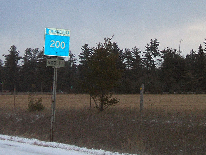 Older style highway marker with small numbers.