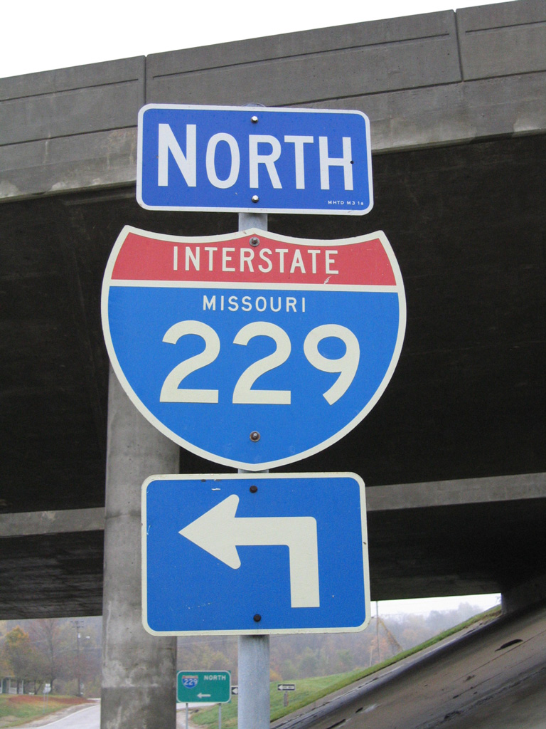 Highland Avenue eastbound at the Exit 7 diamond interchange with Interstate 229. This shield and the guide sign in the background were replaced.