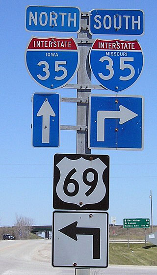 This unique shield assembly on U.S. 69 is located at the Missouri-Iowa state-line interchange. The pole is a Missouri pole, but the US 69 shield and arrow underneath are Iowa-standard. This Photo taken by Jeff Morrison (04/16/07).