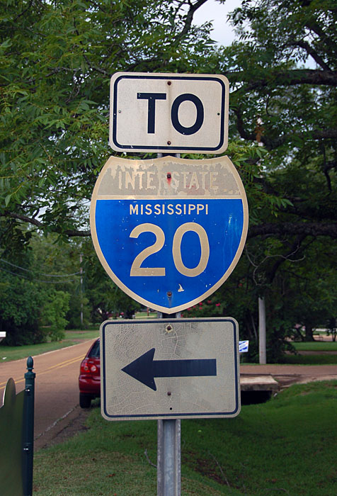 Original (silver scotchlite on steel) shield dating back to the beginning of the interstate system.  The gantry, as evidenced by the white banners, originally pointed to a US-80 freeway.