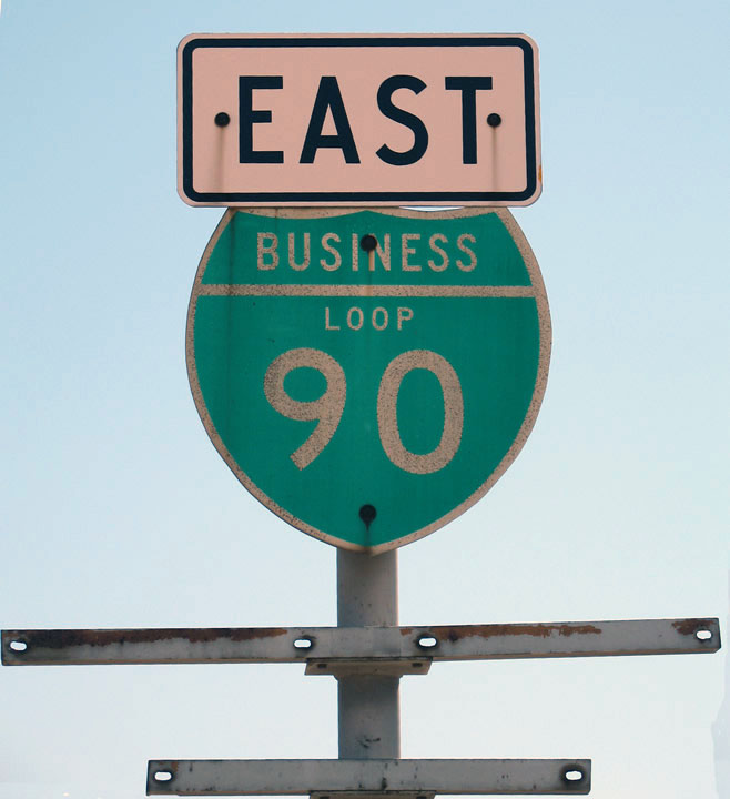 Eastbound Business Loop I-90 with shield brackets for U.S. 10, U.S. 12, U.S. 93, and/or Montana 200 west of downtown Missoula.