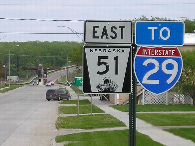 Eastbound Nebraska 51 approaches a toll bridge over Missouri River near Decatur. A trailblazer for Interstate 29 is attached to the final eastbound reassurance shield for this state route. Nebraska 51 changes into Iowa 175 upon crossing the river. Iowa 175 interchanges with Interstate 29 about six miles east of the Missouri River bridge near Onawa.